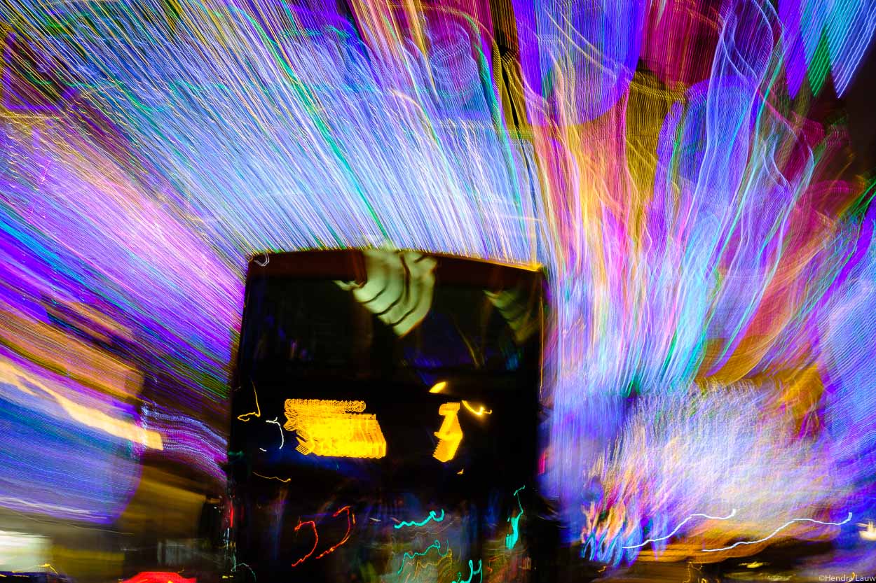 Bus 7 passing by geylang serai at night. Photography by Hendra Lauw.