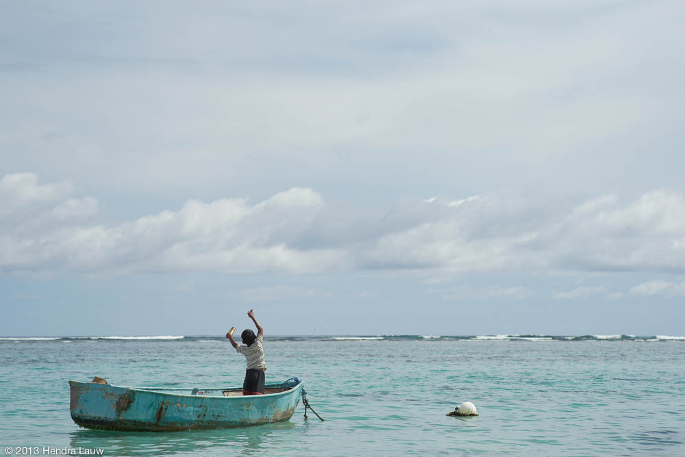 A little boy fishing at Pandawa Beach Bali - Sony A7 and Leica Elmarit 90mm f/2.8