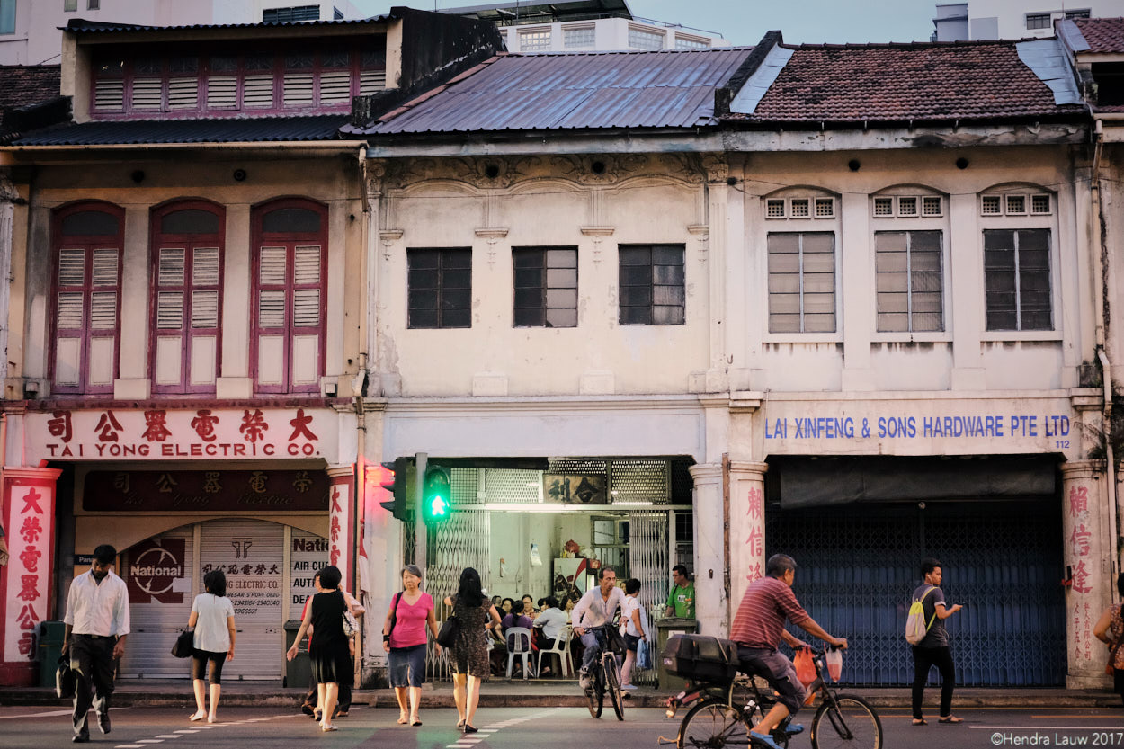 People crossing the road in Jalan Besar Singapore.