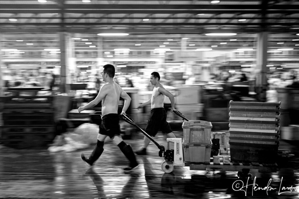 At Singapore’s Jurong Fishery Port, two men work through the night, moving the sea's bounty from one point to another.
